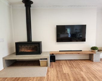 Concrete fire hearth, tv unit with floating hardwood shelf. Open fire stand with polished concrete bespoke hearth, concrete bench and cube