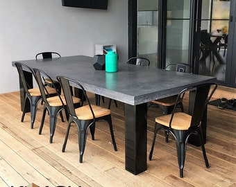 Polished concrete 8 to 10 seater dining table with 4 powder coated black legs, patio alfresco dining.  2.7m x 1.1m charcoal outdoor table