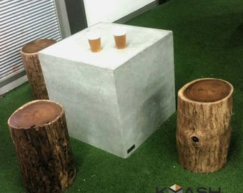 Polished concrete cube table with hardwood - blackwood timber/wooden log tree stump stools.