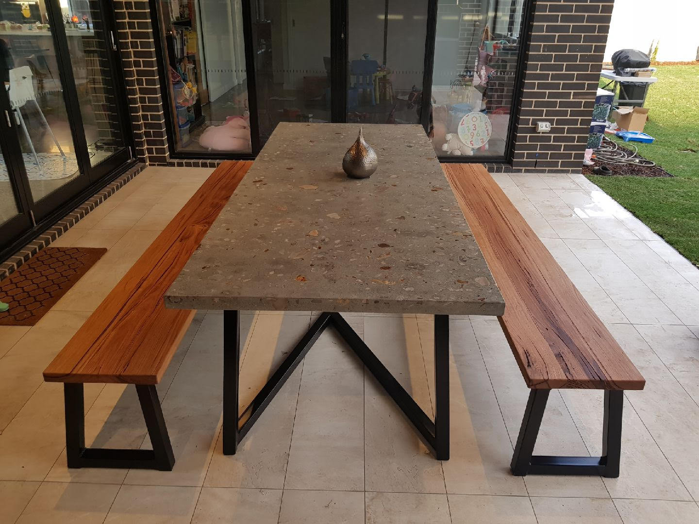 Concrete and metal clearance outdoor dining table