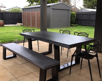 Polished concrete dining table and bench seat, patio alfresco table with powder coated black base.  2.1m x 1.1m charcoal outdoor table