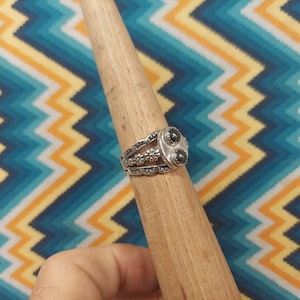 Hematite sterling silver ring with 2----- 6 mm stones. size 11 1/2 with a detailed band.