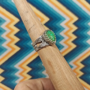 Opal triplet silver ring with a 10 x 14 mm stone , size 9 3/4  with New Angel Wing style band.