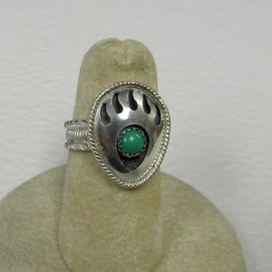 This ring is a BEAR PAW design size 5 with a 5 mm turquoise in it