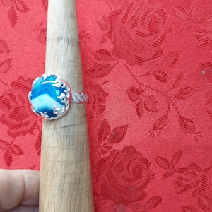 banded agate ring. stone is 20 mm. It is made of sterling silver size 11 1/2. has a very detailed band.