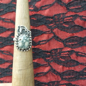 ocean jasper ring size 8 this stone comes from Africa in many colors and designs. It&#39;s bordered with a dolphin and balls. and detailed band.