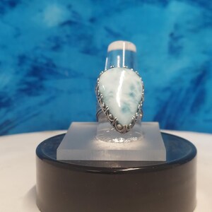 Larimar 18 x 25 mm in a Gallery bezel with a heart pattern band. size 7 3/4.