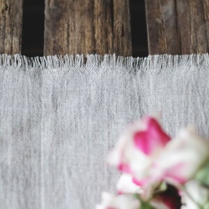 Close-up of natural linen table runner showing soft stone washed linen texture