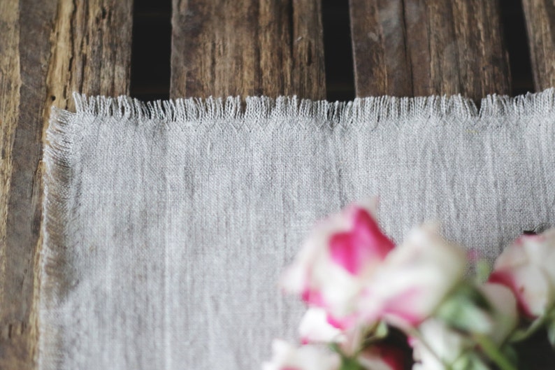 Close-up of natural linen table runner showing soft stone washed linen texture
