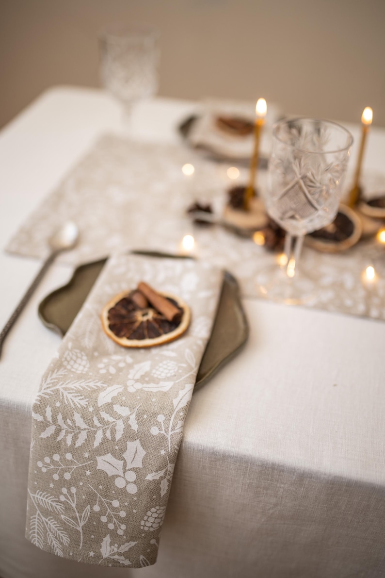 Handmade Christmas linen cotton cloth napkins with Winter Holly sprigs print for holiday hosting decor