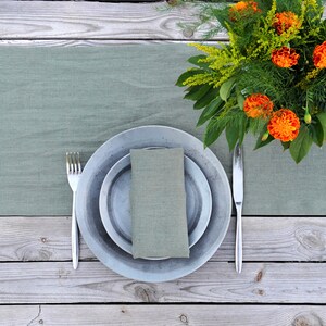 European linen table runner in sage green with elegant dinner table decor