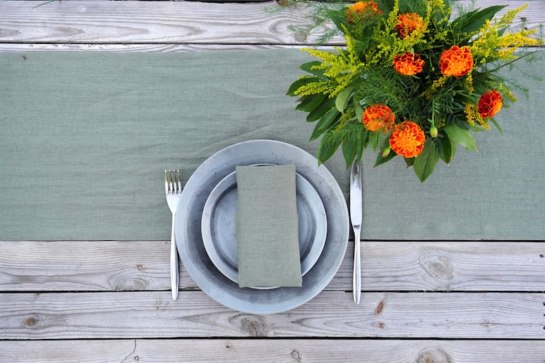 European linen table runner in sage green with elegant dinner table decor