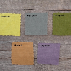 Color options for handmade European linen table runners including chartreuse, sage green, olive green, mustard, ash purple.