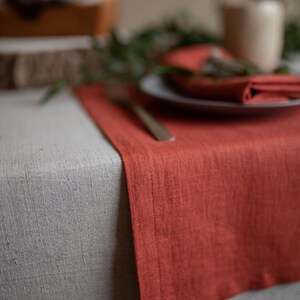 Terracotta table runner close up showing linen texture