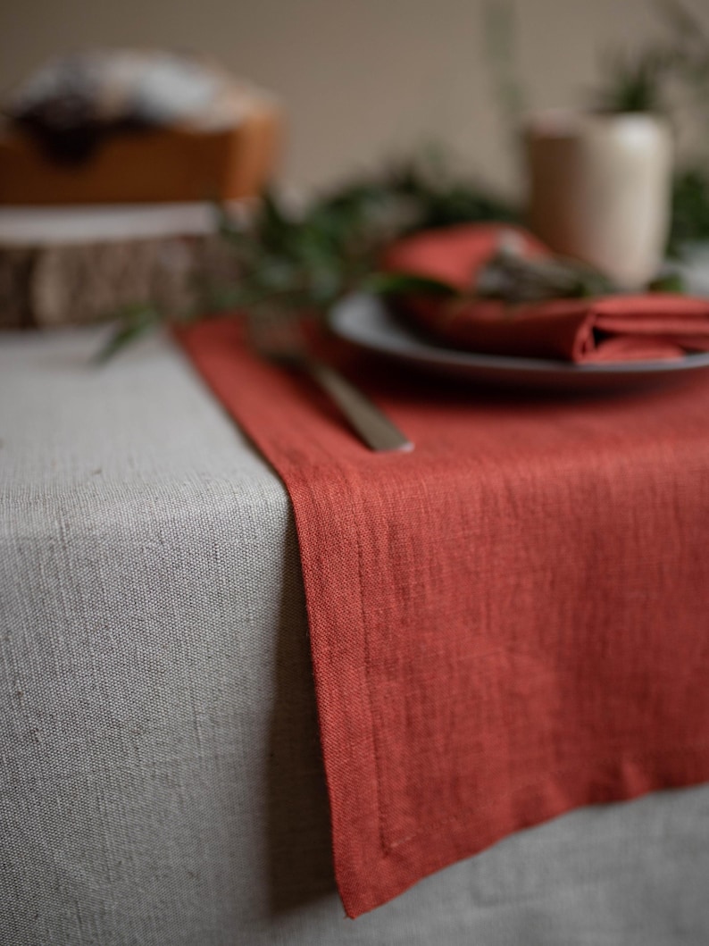Terracotta table runner close up showing linen texture