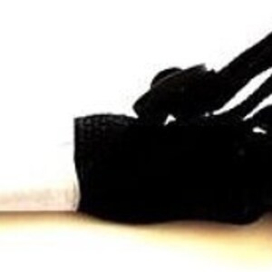 May include: Black nylon strap with two black metal carabiner clips. The strap has a white section and a folded, textured end. The clips are attached to a black plastic buckle.