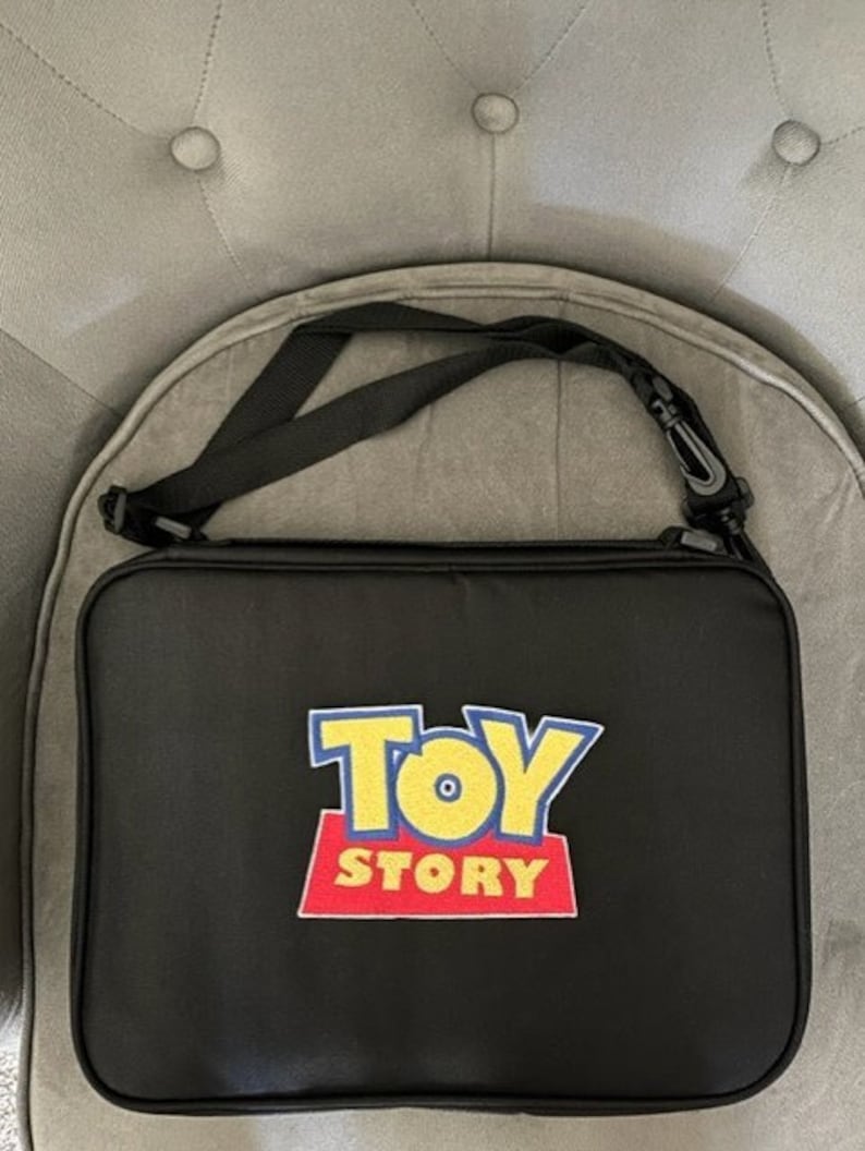 NEW Embroidery Pixar Toy Story Logo Large Pin Trading Book Bag for Disney Pin Collections holds about 300 Hidden Mickey size pins FREE SHIP image 1