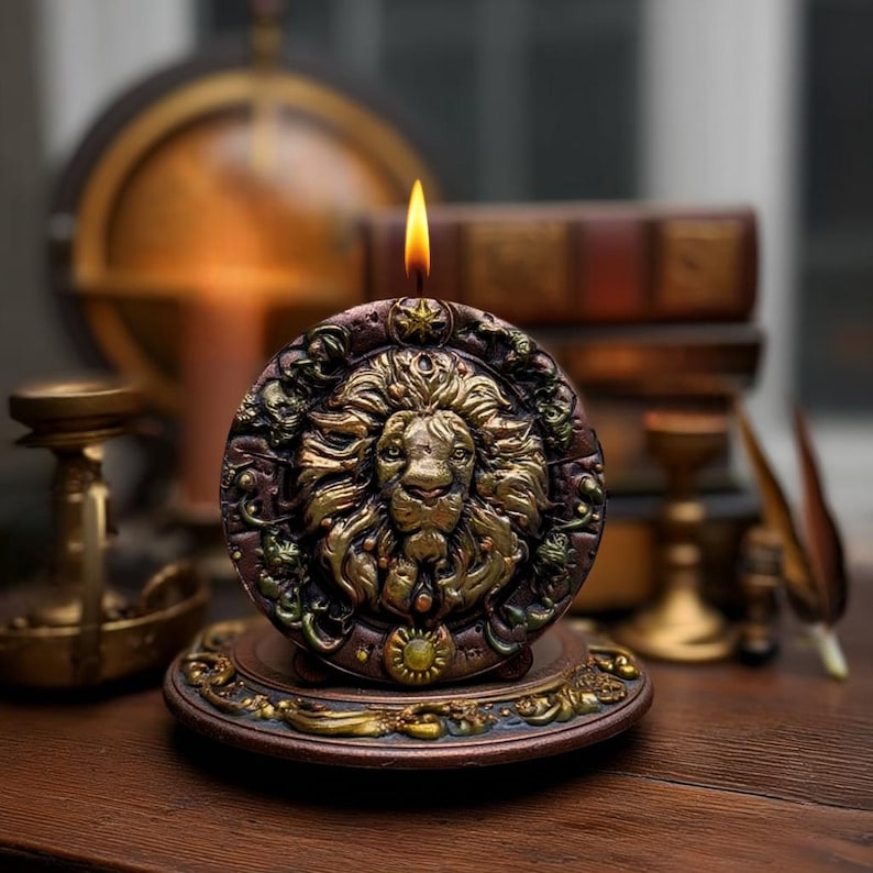 May include: A lit, round candle with a detailed lion's head design in gold and brown tones. The candle sits on a decorative base, with a warm, inviting glow. The background includes antique books and a globe.