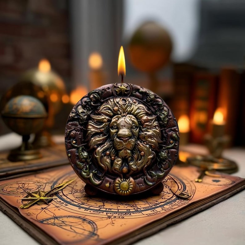 May include: A round, brown candle with a detailed lion's head design in gold and bronze tones. The candle is lit, with a yellow flame. It sits on a map, with other antique items in the background, creating a vintage aesthetic.