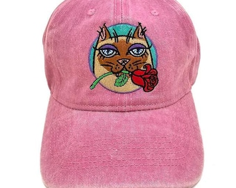 Siamese cat with a rose in his teeth. Embroidered cat hat for humans.