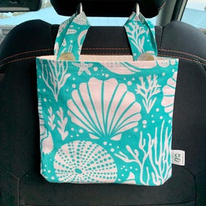 Washed Ashore White on Aqua: Car garbage bag, vinyl lined, earth-friendly.