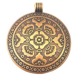 May include: A round, bronze-colored pendant with an intricate floral design. The pendant features a central flower motif surrounded by detailed patterns and a beaded border. It has a loop at the top for a chain.