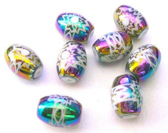 May include: A group of eight iridescent oval beads with white geometric designs. The beads have a rainbow sheen and are perfect for jewelry making.