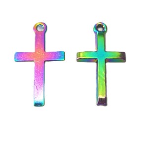May include: Two iridescent cross pendants. The crosses have a rainbow finish, with colors shifting from pink to blue and green. Each cross has a small loop at the top for hanging. The background is plain white.