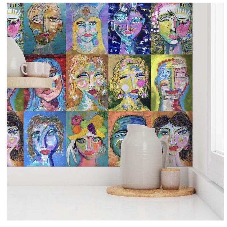 May include: A colorful wall mural featuring a grid of 12 abstract faces painted in bright colors. The faces are all different shapes and sizes, and they have a variety of expressions. The mural is a unique and eye-catching piece of art.