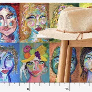 May include: A collage of eight colorful portraits of women with various hairstyles and accessories. The portraits are arranged in a grid pattern and are painted in a whimsical style. A straw hat with a brown leather band is placed on top of the collage.