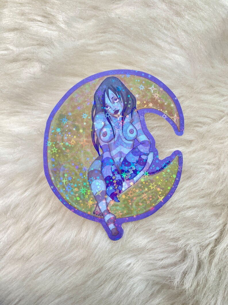 May include: A holographic sticker featuring a blue-toned illustration of a woman sitting on a crescent moon with stars. The woman is wearing a striped outfit and has long dark hair. The sticker has a purple border.