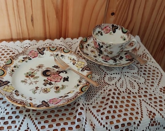 Vintage cup, saucer, side plate, spoon and cake fork.  Also includes sachet of tea and biscuit selection.