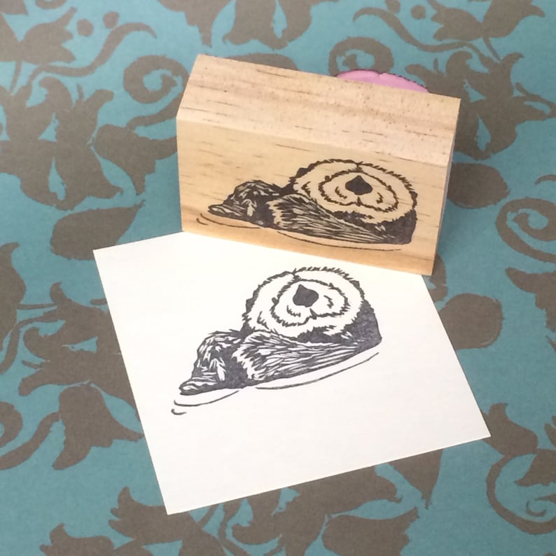 Hand carved rubber stamp otter design.