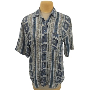 Camisa Bruno de manga larga para hombre, azul medio, seda, diseño geométrico abstracto, ligera, informal.