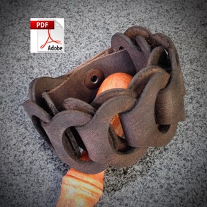 May include: A brown leather bracelet with a unique woven design. The bracelet has a snap closure and is made of thick, durable leather.
