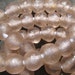 African recycled glass beads, (13 mm diam.) 12" strand, 27 beads, pale pink