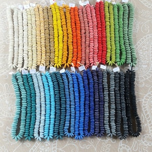 8 inches string, 35-40 large saucer beads, 13-15 x 4-5 mm., 30 colors