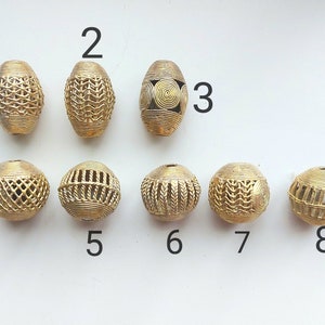 One large round or oval bead, brass handmade beads, 36 x 36 mm., focal Ashanti brass beads