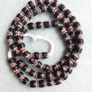 35+ Indian chevron beads, half of the whole strand, 8-9 mm.diam. x 10 mm., handmade glass beads