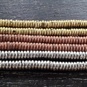 8 inches strand, approx. 150 rings, 4 mm.diameter, handmade in Ethiopia