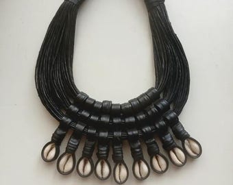 Handwoven Leather and Bold Cowry Shell Necklace