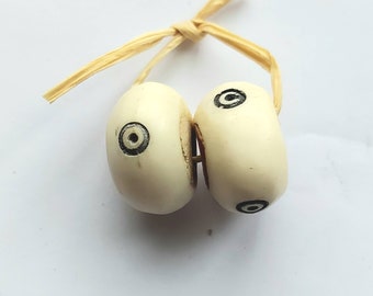 2 Kenya batik bone beads (23-26 mm.diam.. x 14-15 mm.), not dyed, African Trade