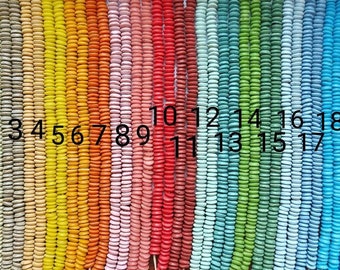 8 inches strand, 55+ African small saucer beads, 10 x 3-4 mm.