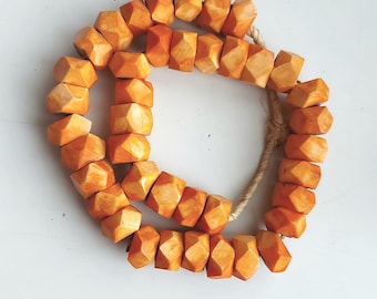 40 facetted Kenya bone beads (23-26 x 13-15 mm.), shipped from Spain