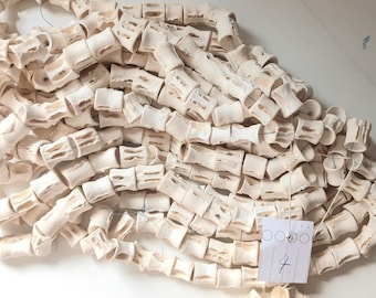 40 cm (16 inches string), 10-11 mm. diameter fish bone, fish vertebrae #4