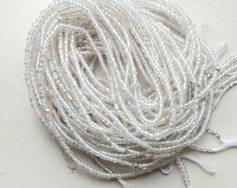 Iridescent transparent white waist beads, tie on, strand 42/44 inches, 108/112 cm.