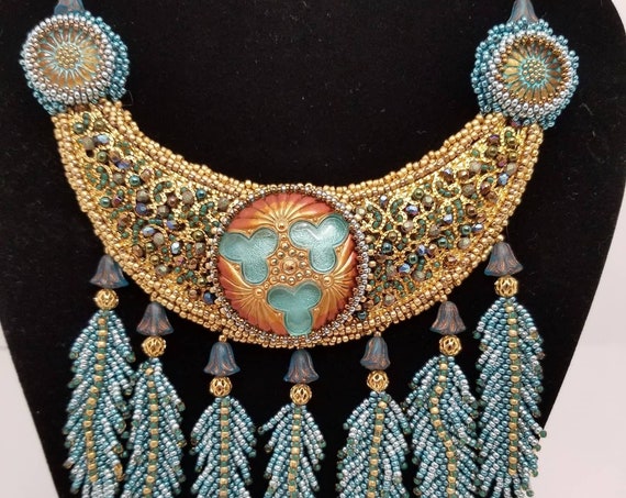 Flight with blue feathers necklace with matching earrings Rita Caldwell