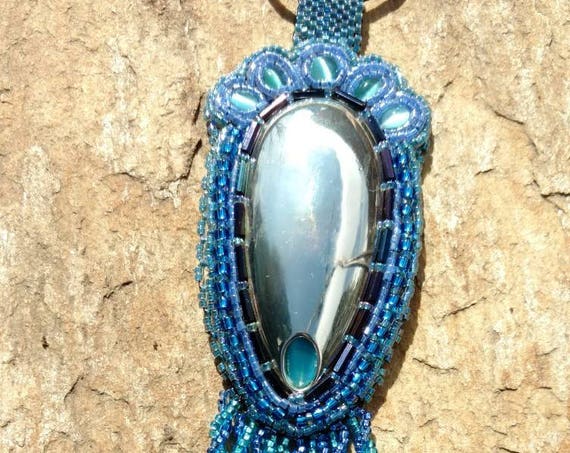 Twisted in Silver and blue native american inspired beadwork by Beadworkdreamsraven, Rita Caldwell.