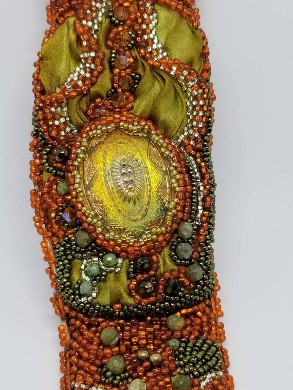 Shimmering gold and orange bracelet Rita Caldwell Native American inspired
