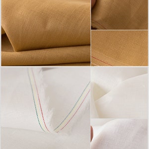 May include: Close-up of two fabric swatches. One is a light brown linen fabric and the other is a white linen fabric with red, green, and yellow stitching.